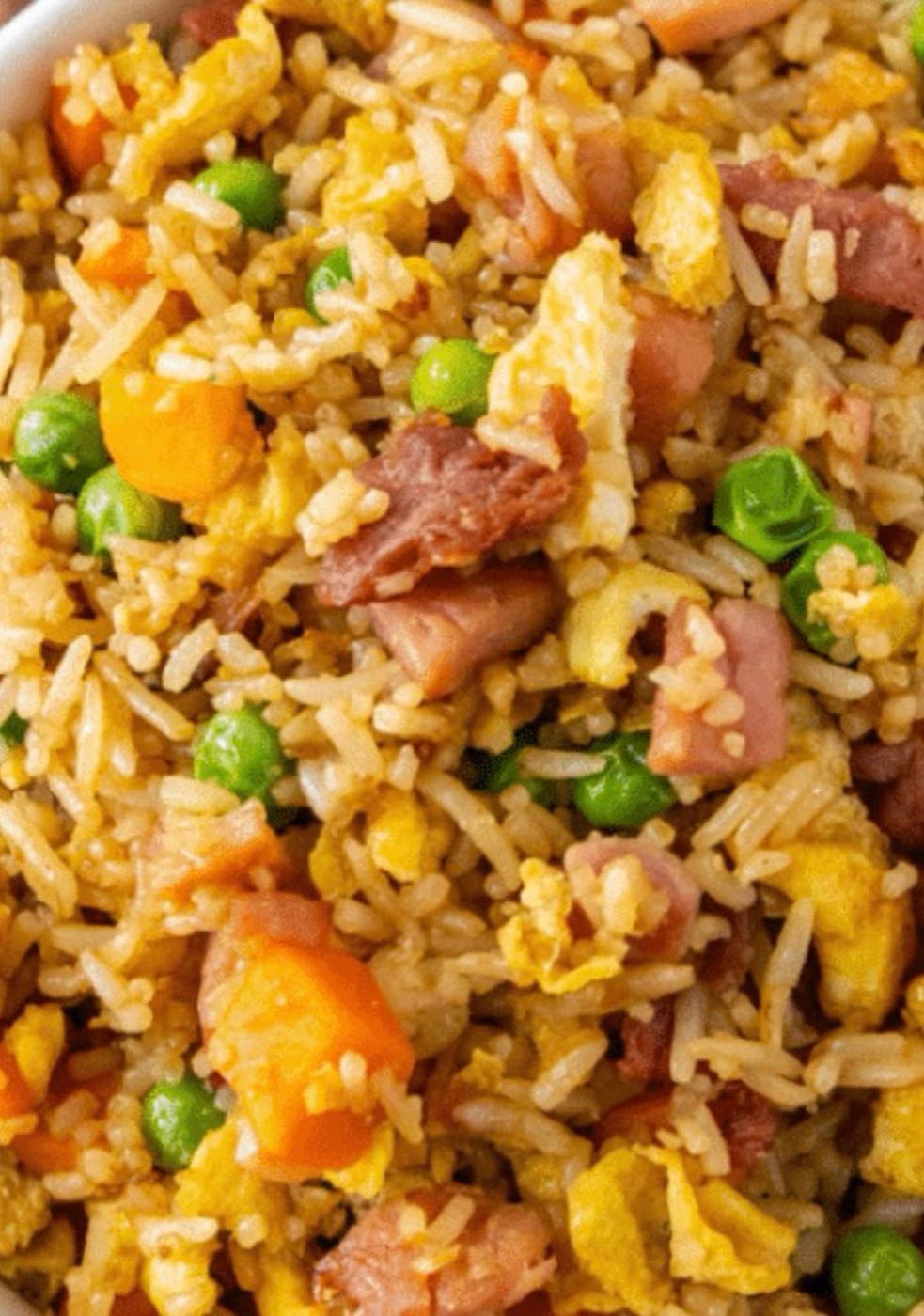 House fried rice with ham, egg, peas and carrots