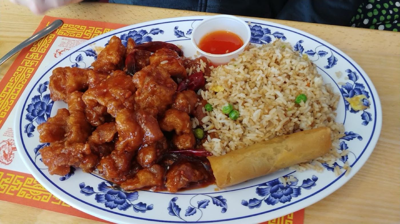 Combo plate with General Tso's chicken, fried rice and an egg roll